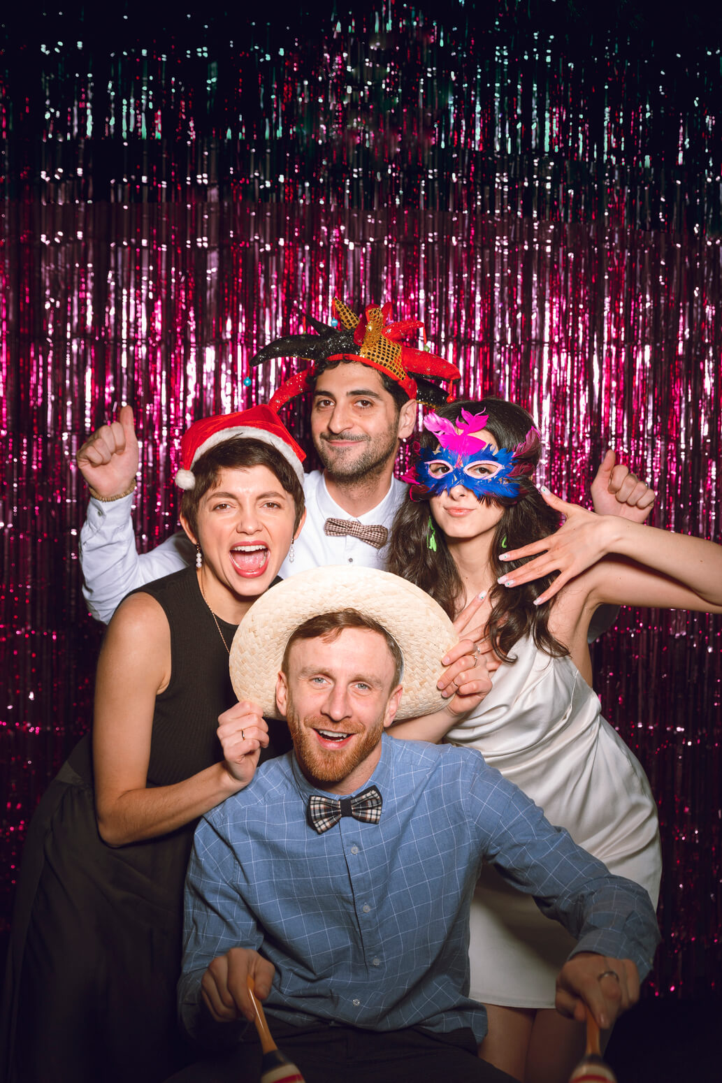 medium-shot-friends-posing-together-photobooth (1) (1)